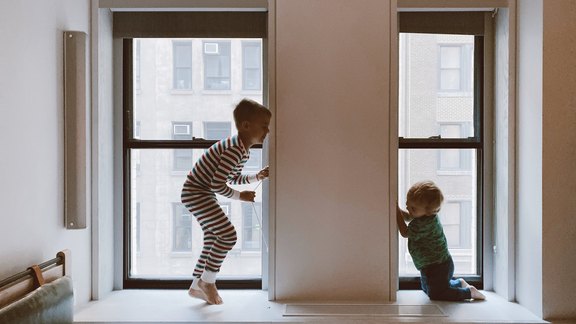 two-kids-playing-beside-glass-windows-3273851.jpg  